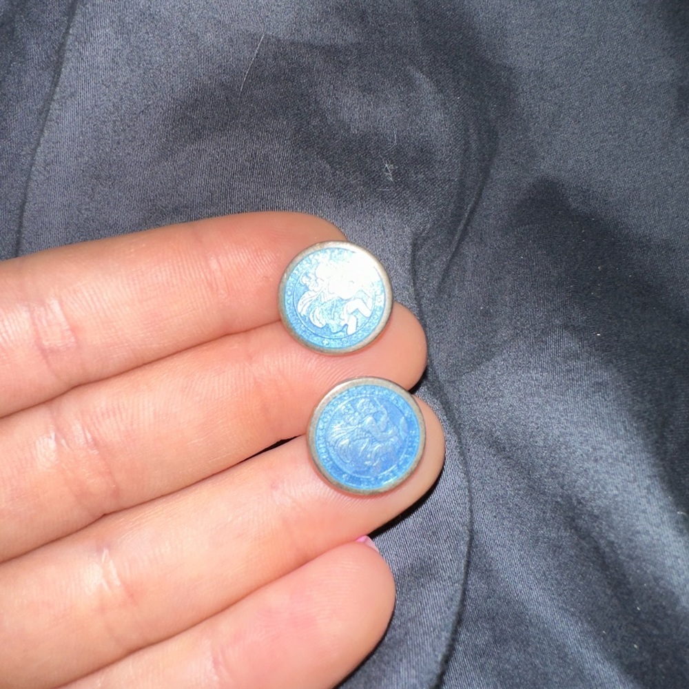 Saint Christopher earrings. Worn but in excellent condition. Sterling silver